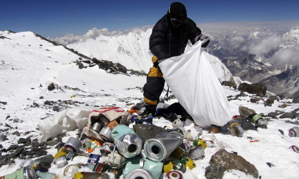 (FILES) This picture taken on May 23, 2010 shows a Nepalese sherpa collecting garbage, left by climbers, at an altitude of 8,000 metres during the Everest clean-up expedition at Mount Everest.  Climbers scaling Mount Everest will have to bring back eight kilograms (17.6 pounds) of garbage under new rules designed to clean up the world's highest peak, a Nepalese official said March 3, 2014.     AFP PHOTO/Namgyal SHERPA/FILESNAMGYAL SHERPA/AFP/Getty Images